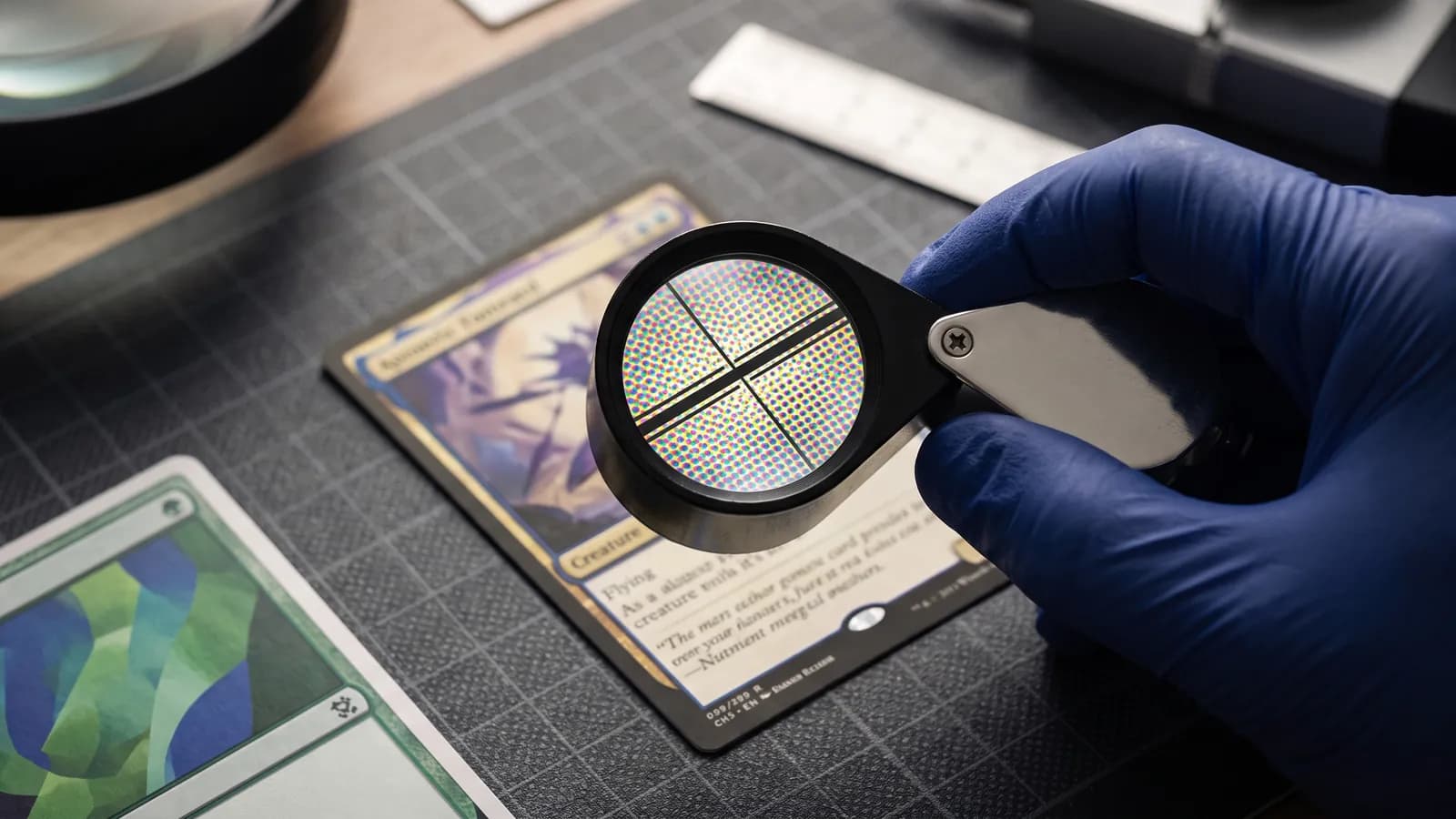 Loupe showing rosette color dots and crisp black printing on a trading card